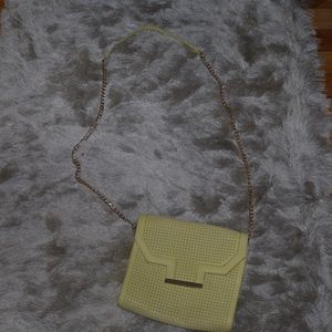 Yellow preforrated cross body bag